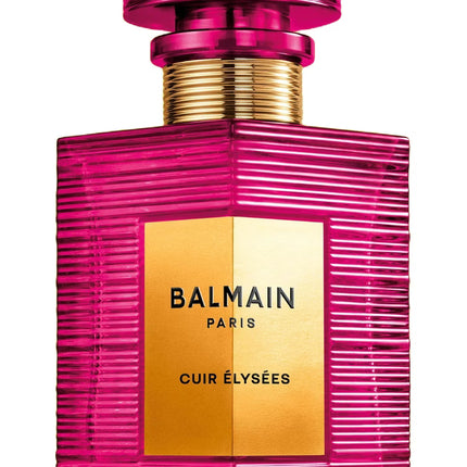 Pink perfume bottle with gold label featuring Balmain Paris on a white background