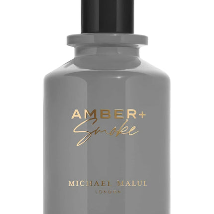 Gray perfume bottle with gold text on a white background