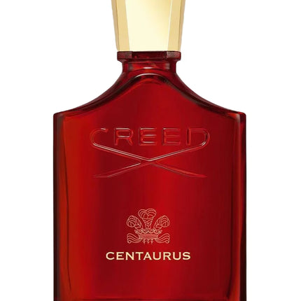 Red Creed Centaurus perfume bottle with gold cap on a white background