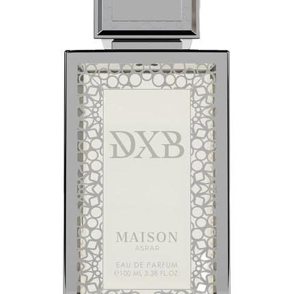 Silver perfume bottle with intricate design and 'DXB' branding on a white background