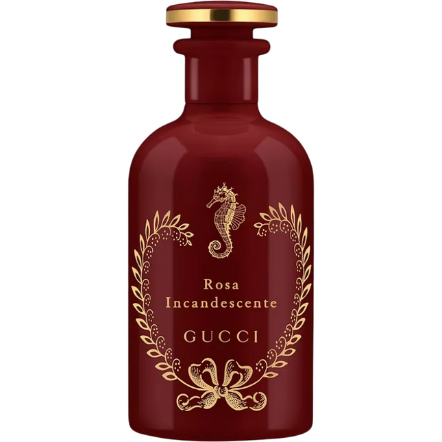 Red Gucci perfume bottle with gold design and text on a white background