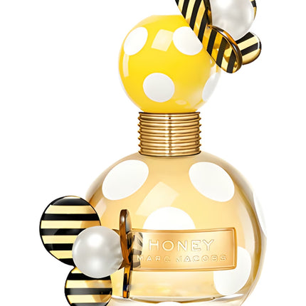 Marc Jacobs Honey perfume bottle with yellow polka dot design and bee decorations on a white background