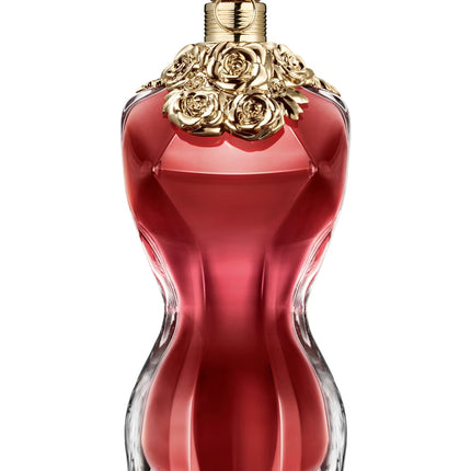 Red perfume bottle with gold cap on a white background