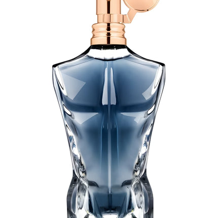 Blue perfume bottle with rose gold cap on a white background