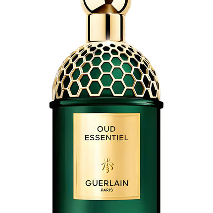 Guerlain Oud Essentiel perfume bottle with gold cap on a white background