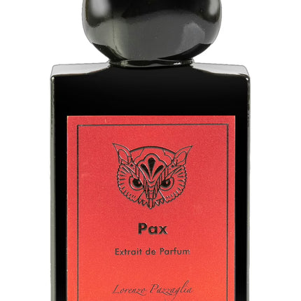 Perfume bottle with red label featuring an owl design and black cap on a white background