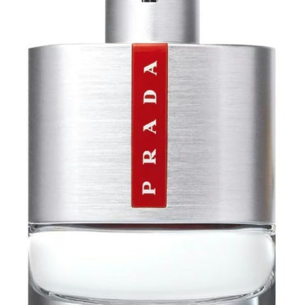 Prada perfume bottle with silver cap and red label on a white background