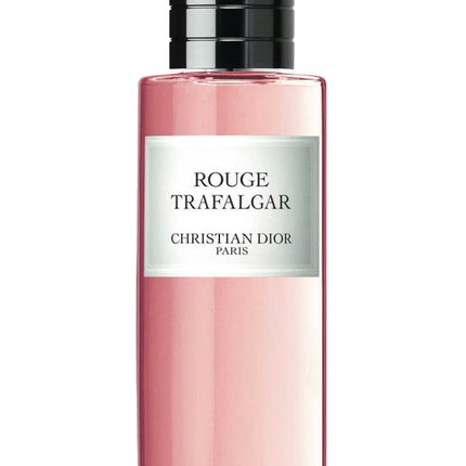 Pink perfume bottle with black cap and white label on a white background