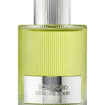 Tom Ford perfume bottle with green body and silver cap on a white background