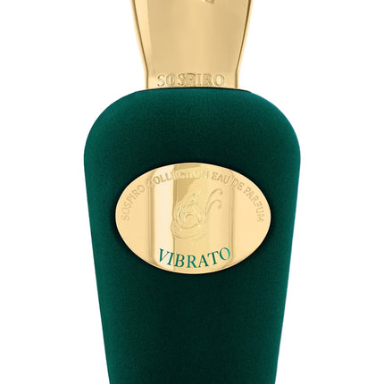 Green perfume bottle with gold cap on a white background