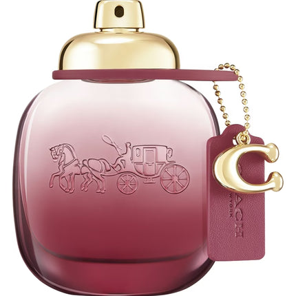 Decanted Coach Wild Rose for women, featuring red currant and bergamot top notes, a heart of rose and jasmine, and a base of amber and musk