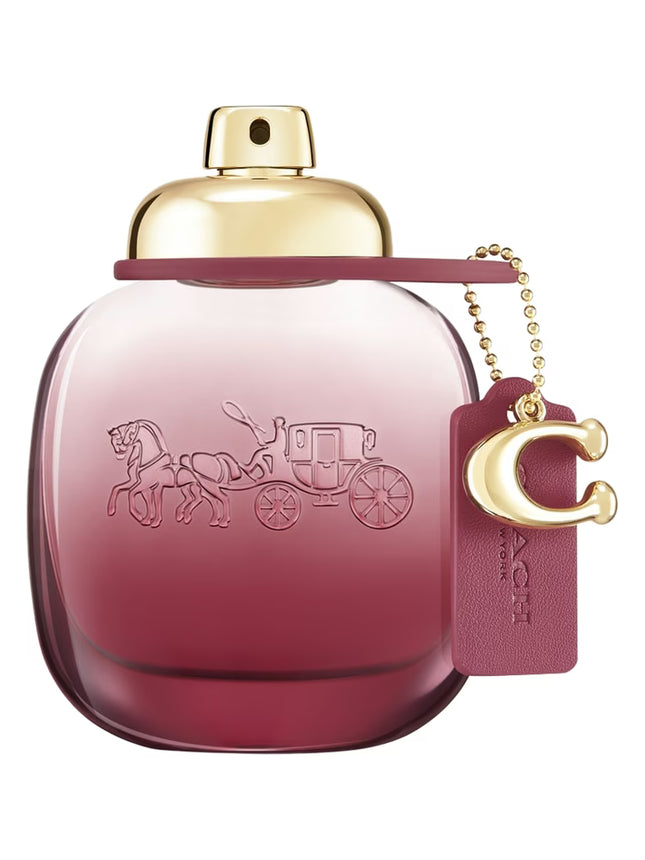 Decanted Coach Wild Rose for women, featuring red currant and bergamot top notes, a heart of rose and jasmine, and a base of amber and musk